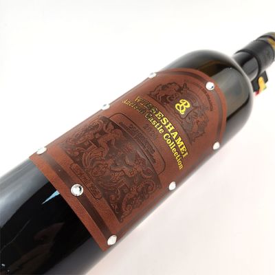 Buon prezzo OEM Brand Stamping Etichetta in cuoio in PU personalizzata per vino Etichette in cuoio personalizzate Adesivo in linea