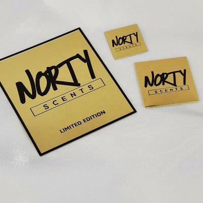 Buon prezzo Notebook in metallo personalizzato Perfume Etichetta di nichel Trasferimento Adesivo in metallo in oro in rilievo 3d in linea